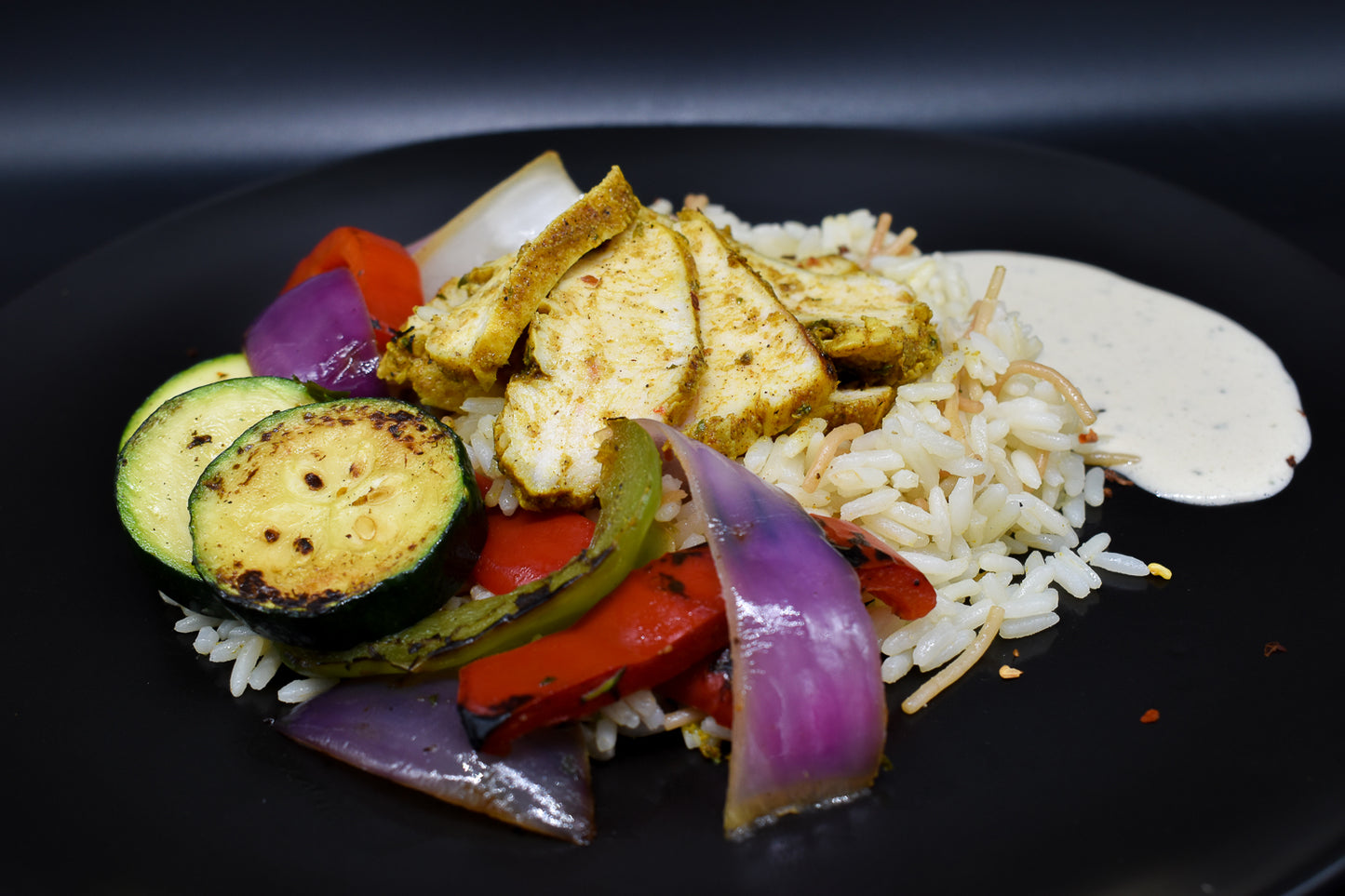 Vermicelli rice, grilled chicken with a mint-tahini sauce.